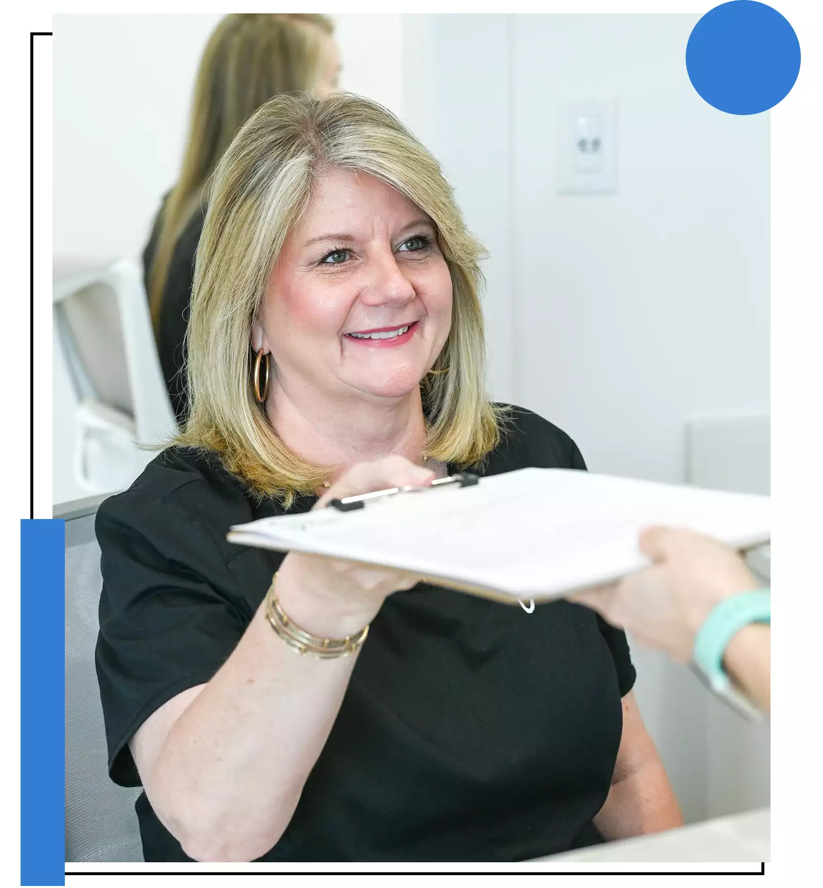 A Mosal Dental Care team member welcoming a patient at the front desk